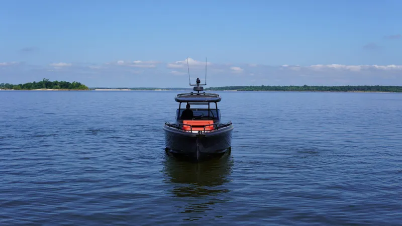 Slide: The Image of BRABUS Shadow 900 Sun Top 2020 boat cruising on a calm lake with clear skies. - 11