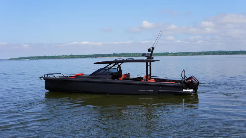 Slide: The Image of 2020 BRABUS Shadow 900 Sun Top boat on calm water, side view. - 16