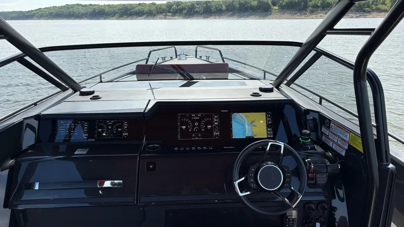 Slide: The Image of Cockpit view of 2020 BRABUS Shadow 900 Sun Top, featuring advanced navigation displays. - 18