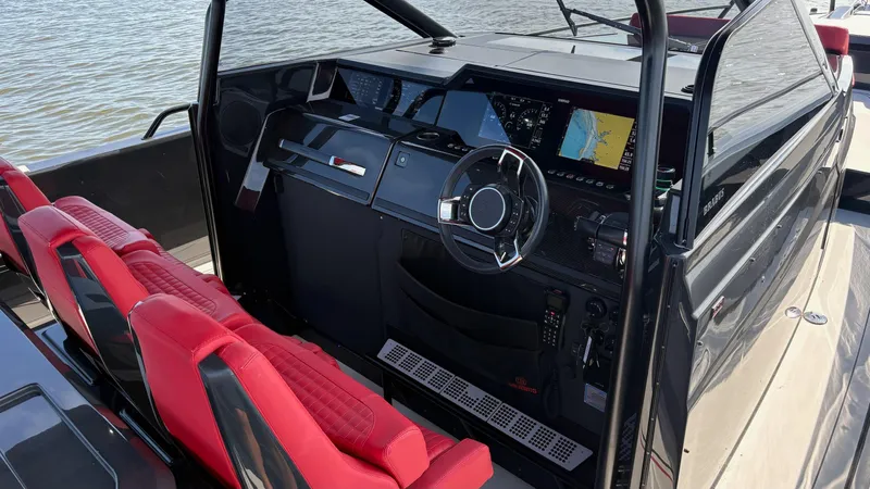 Slide: The Image of Cockpit of 2020 BRABUS Shadow 900 Sun Top with red seats and advanced navigation system. - 19