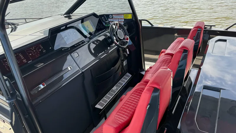 Slide: The Image of Interior of 2020 BRABUS Shadow 900 Sun Top with red seats and modern dashboard. - 20