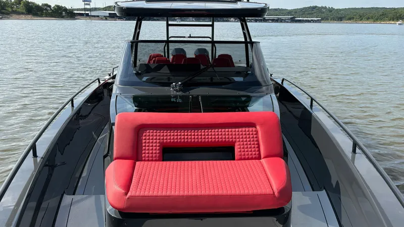 Slide: The Image of BRABUS Shadow 900 Sun Top 2020 with red seating, on calm water. - 24