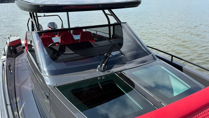 Slide: The Image of 2020 BRABUS Shadow 900 Sun Top boat with sleek design on calm water. - 26