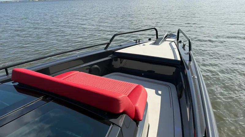 Slide: The Image of BRABUS Shadow 900 Sun Top 2020 boat with red seating, on calm water. - 28