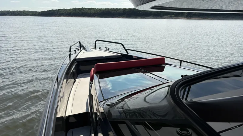 Slide: The Image of 2020 BRABUS Shadow 900 Sun Top yacht on calm water, showcasing sleek design. - 30