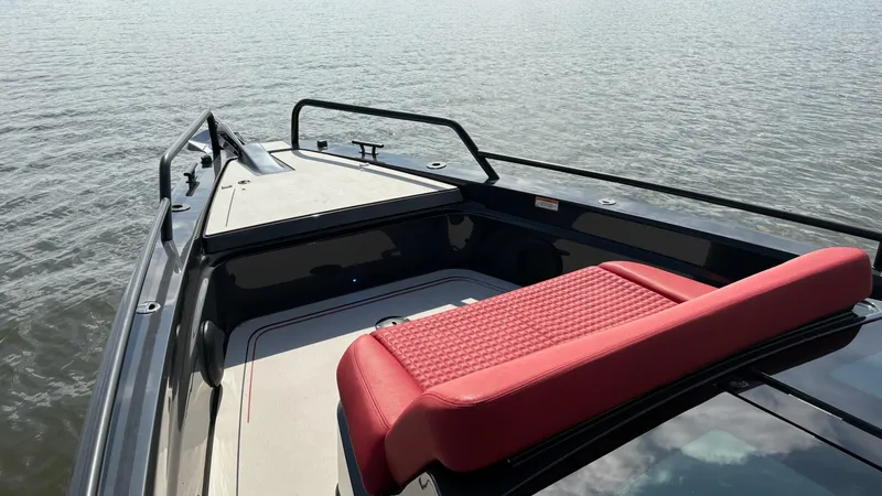 Slide: The Image of 2020 BRABUS Shadow 900 Sun Top boat with red seating, on calm water. - 31