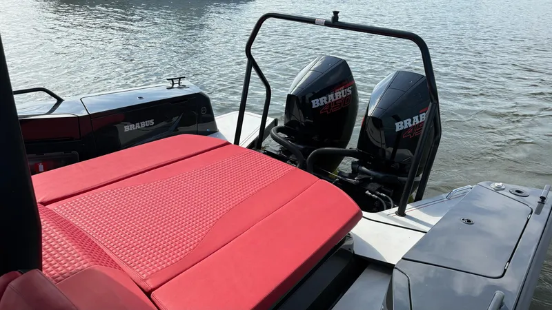 Slide: The Image of BRABUS Shadow 900 Sun Top 2020 with red seating and dual engines on water. - 35