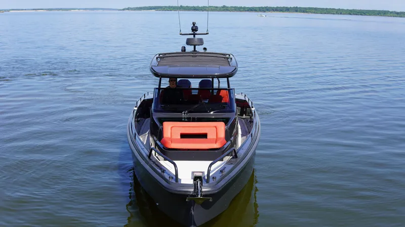 Slide: The Image of 2020 BRABUS Shadow 900 Sun Top boat cruising on open water. - 4