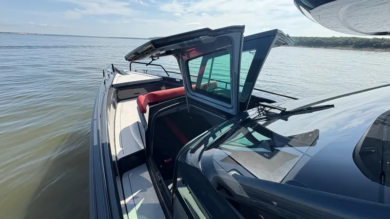 Slide: The Image of BRABUS Shadow 900 Sun Top 2020 yacht on calm water, featuring sleek design and open sunroof. - 49
