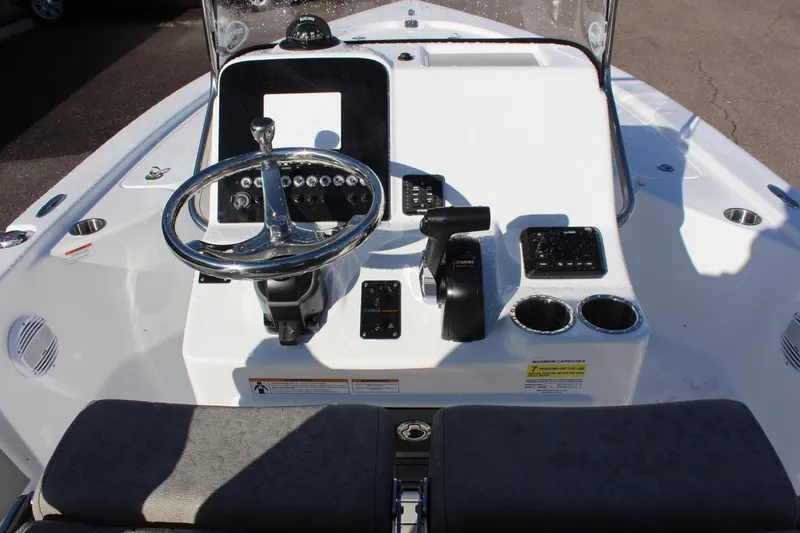 Slide: The Image of 2023 Sea Pro 208 Bay boat console with steering wheel and controls. - 18
