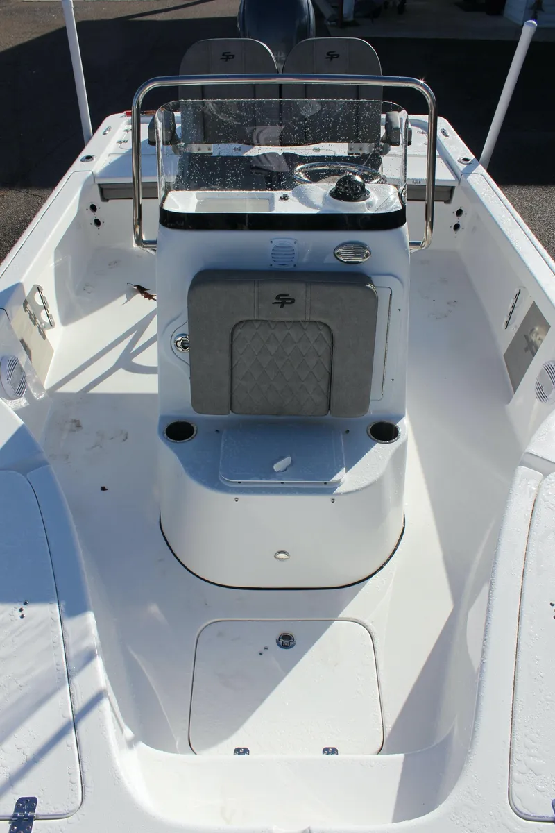 Slide: The Image of 2023 Sea Pro 208 Bay boat interior with center console and seating. - 20