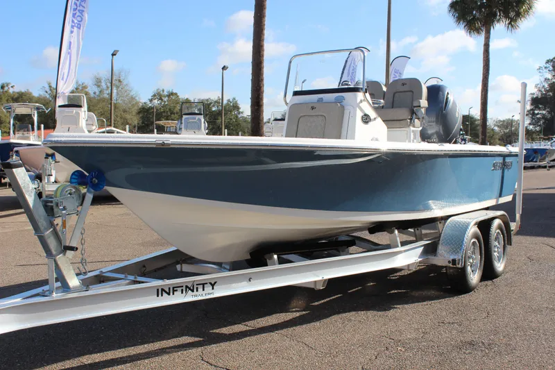 Slide: The Image of 2023 Sea Pro 208 Bay boat on Infinity trailer, displayed outdoors. - 3