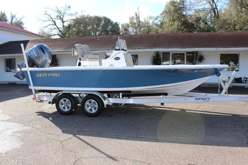 Slide: The Image of 2023 Sea Pro 208 Bay boat on a trailer in front of a building. - 5