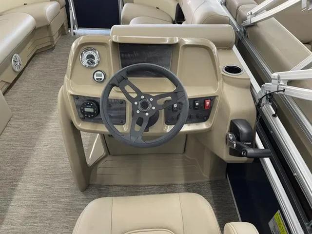 Slide: The Image of 2023 Starcraft LX 16 R boat helm with steering wheel and control panel. - 12