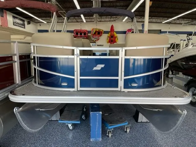 Slide: The Image of 2023 Starcraft LX 16 R pontoon boat in showroom. - 3