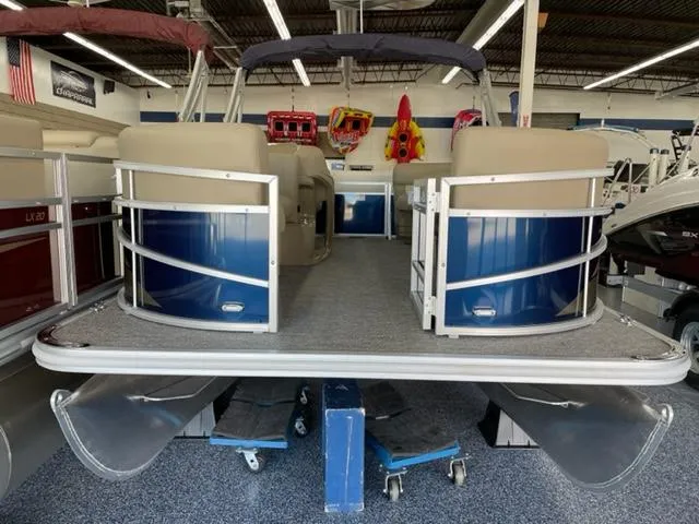 Slide: The Image of 2023 Starcraft LX 16 R pontoon boat in showroom. - 4