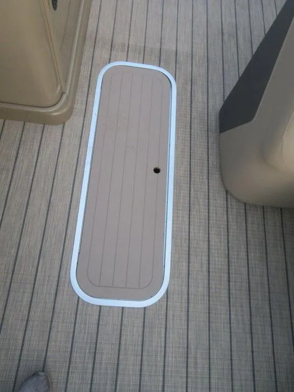 Slide: The Image of 2023 SunChaser Eclipse 25 LR DH deck hatch on textured flooring. - 10