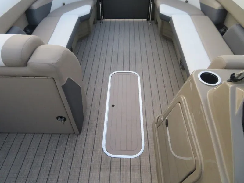 Slide: The Image of 2023 SunChaser Eclipse 25 LR DH boat interior with beige seating and flooring. - 12