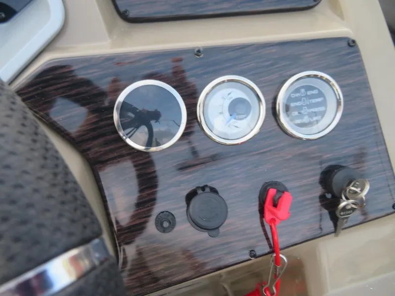 Slide: The Image of Dashboard of 2023 SunChaser Eclipse 25 LR DH boat with gauges and ignition. - 21