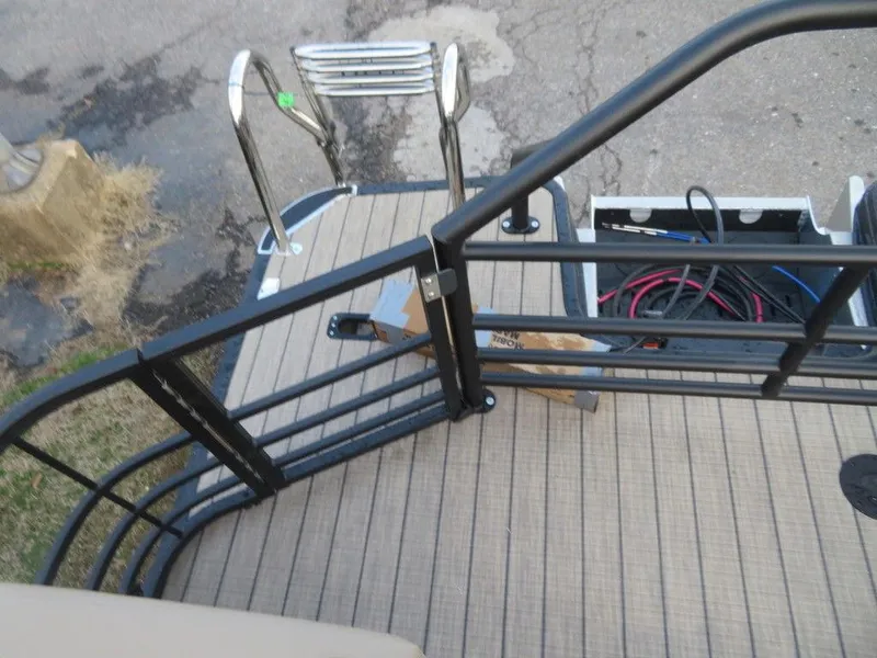 Slide: The Image of 2023 SunChaser Eclipse 25 LR DH boat deck with ladder and storage compartment. - 22