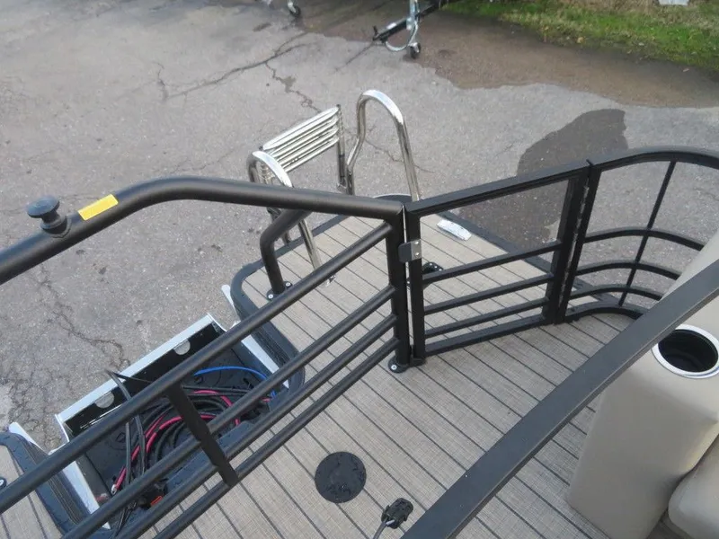 Slide: The Image of Rear deck view of 2023 SunChaser Eclipse 25 LR DH pontoon boat with safety railing. - 25