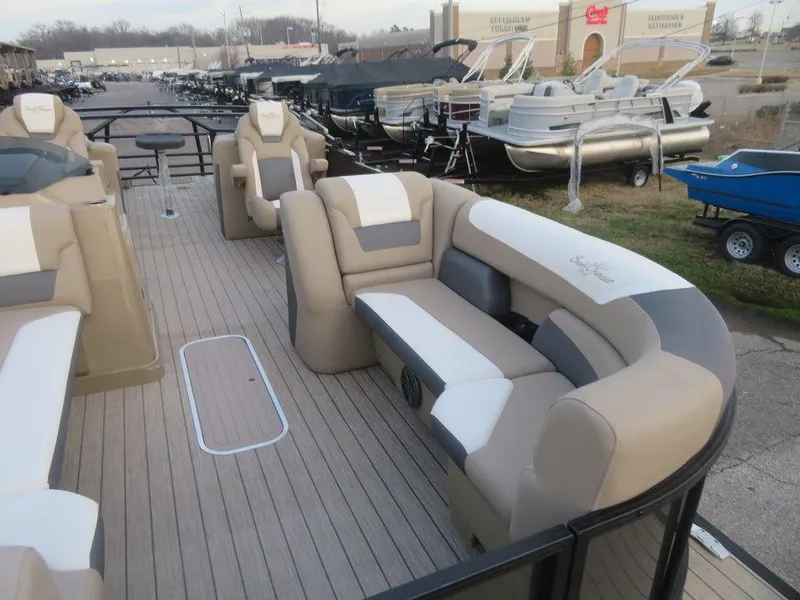 Slide: The Image of 2023 SunChaser Eclipse 25 LR DH pontoon boat with beige and white seating. - 3