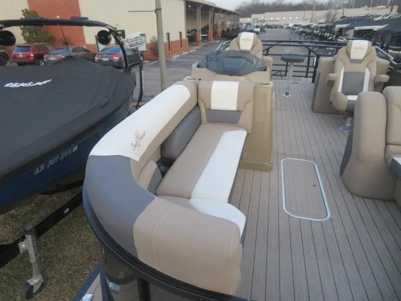 Slide: The Image of 2023 SunChaser Eclipse 25 LR DH pontoon boat with beige and white seating. - 4