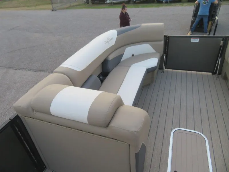 Slide: The Image of 2023 SunChaser Eclipse 25 LR DH pontoon boat with beige and white seating. - 8