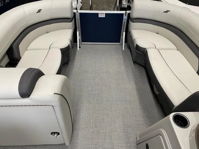 Slide: The Image of 2023 Starcraft EX 22 R pontoon boat interior with plush seating. - 16