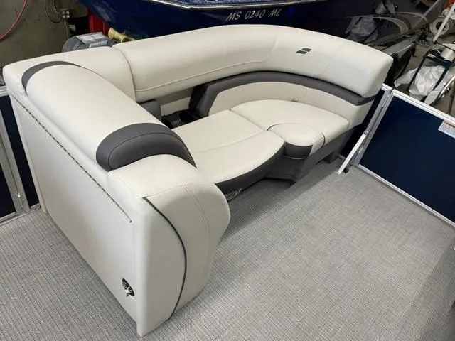 Slide: The Image of 2023 Starcraft EX 22 R boat interior seating with gray and white upholstery. - 17