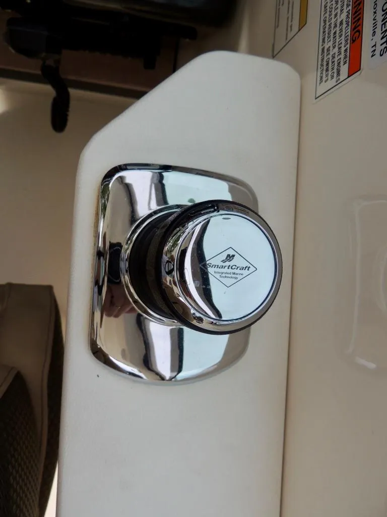 Slide: The Image of SmartCraft control knob on a 2016 Sea Ray 350 Sundancer boat. - 10