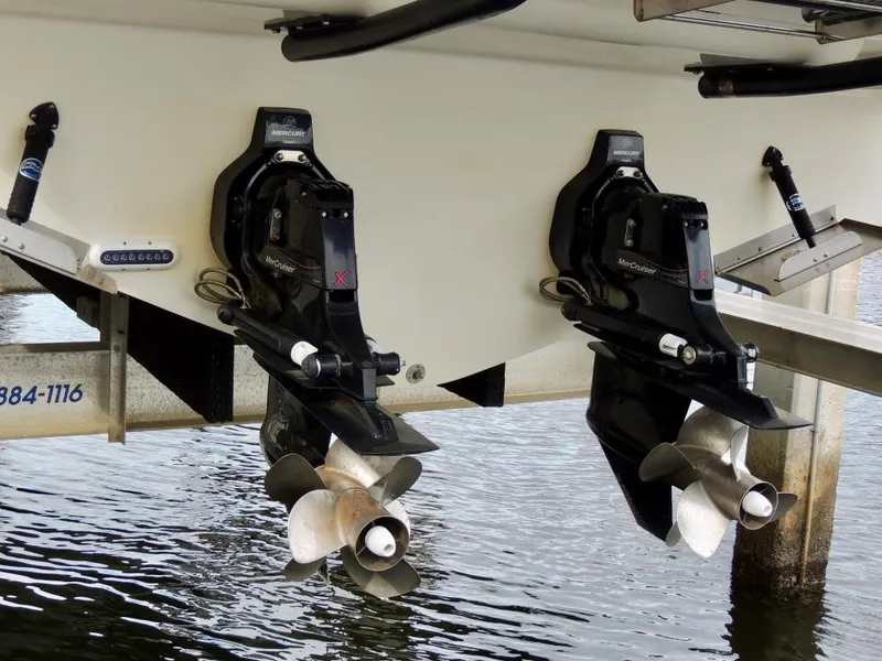 Slide: The Image of 2016 Sea Ray 350 Sundancer twin propellers in water. - 12