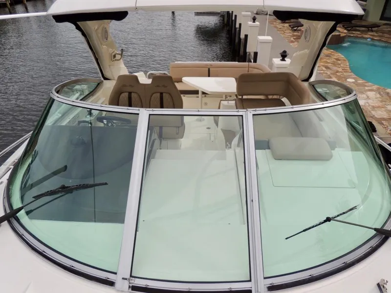 Slide: The Image of 2016 Sea Ray 350 Sundancer boat with spacious cockpit and seating area. - 36