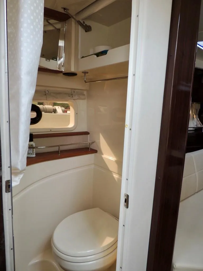 Slide: The Image of 2016 Sea Ray 350 Sundancer bathroom with modern amenities and sleek design. - 45