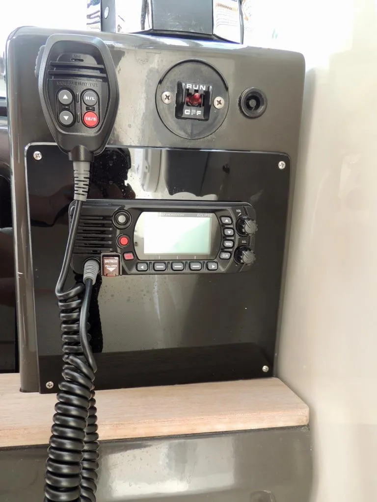Slide: The Image of VHF radio and control panel on a 2016 Sea Ray 350 Sundancer boat. - 8