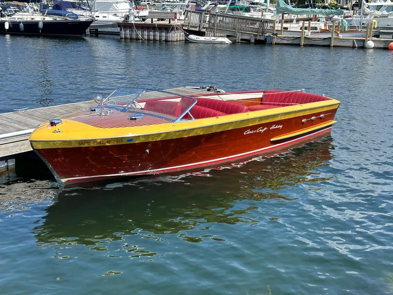 The Image of 1953 Chris-Craft HOLIDAY 24 classic wooden boat docked at a marina. - 0