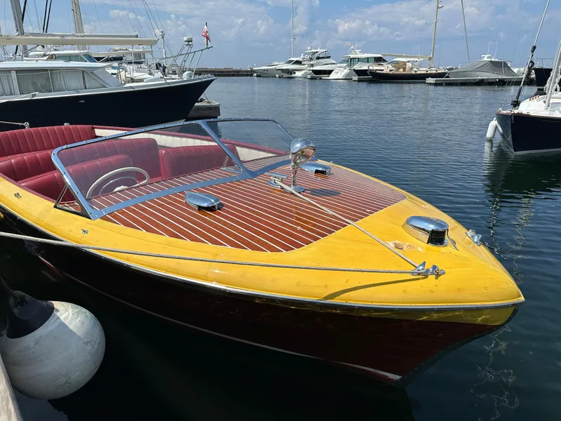 Slide: The Image of 1953 Chris-Craft HOLIDAY 24 classic wooden boat docked at marina. - 2