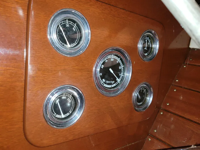 Slide: The Image of 1953 Chris-Craft HOLIDAY 24 dashboard with vintage gauges. - 26