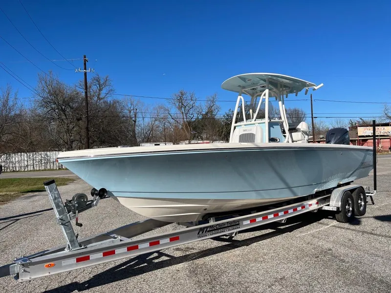 Slide: The Image of 2023 Pathfinder 2700 Open boat on a trailer in a parking lot. - 1