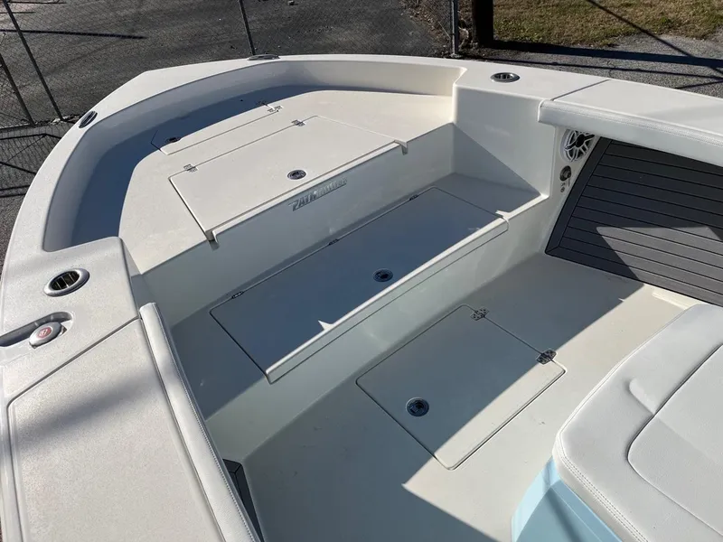 Slide: The Image of 2023 Pathfinder 2700 Open boat interior with storage compartments and seating. - 10