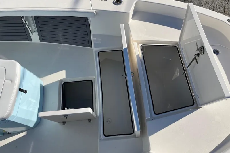 Slide: The Image of 2023 Pathfinder 2700 Open boat storage compartments and seating area. - 12