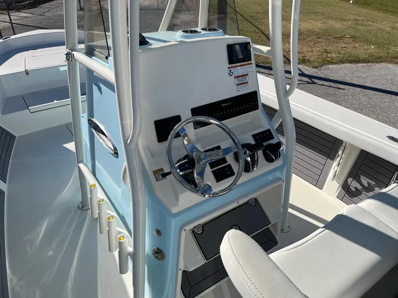 Slide: The Image of 2023 Pathfinder 2700 Open boat console with steering wheel and controls. - 13