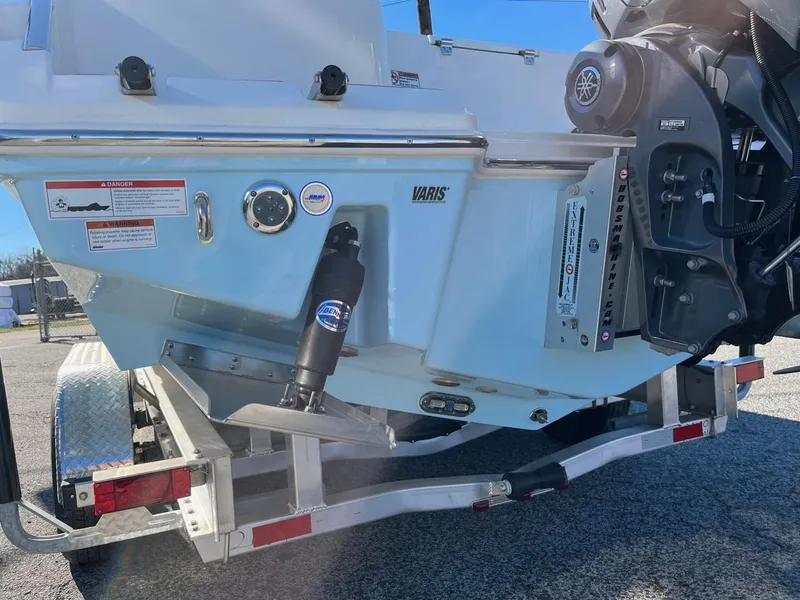 Slide: The Image of 2023 Pathfinder 2700 Open boat on trailer, rear view showing engine and hydraulic system. - 6