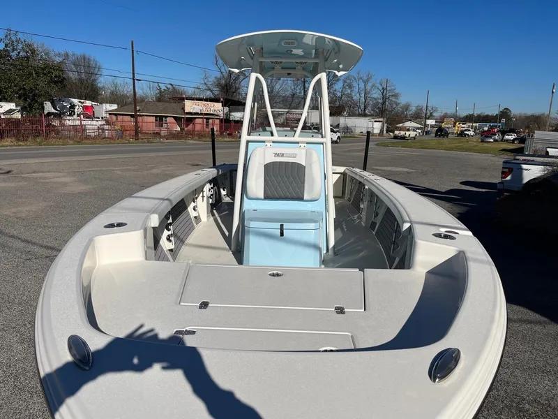 Slide: The Image of 2023 Pathfinder 2700 Open boat with center console and T-top in a parking lot. - 8