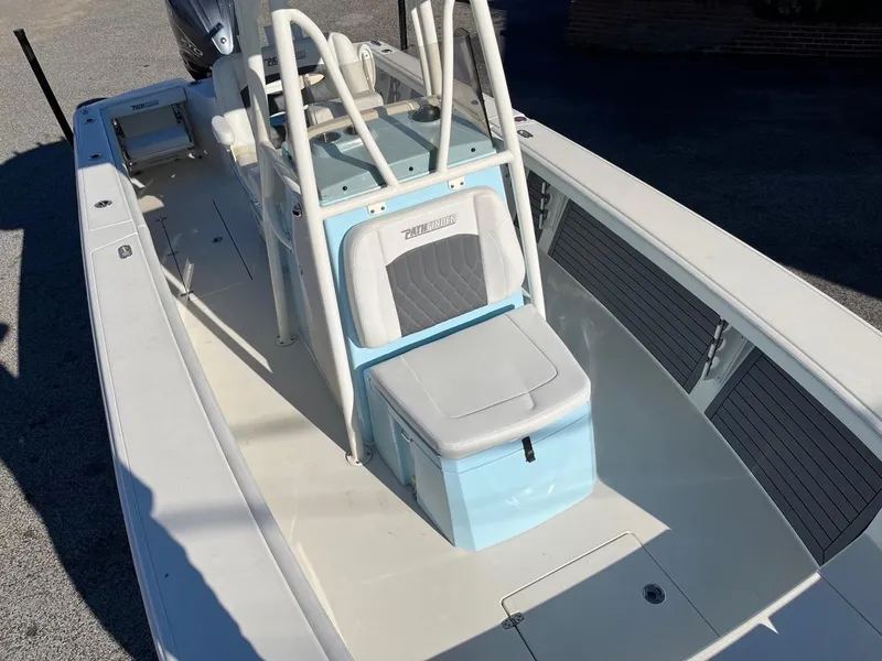 Slide: The Image of 2023 Pathfinder 2700 Open boat interior with seating and storage compartments. - 9