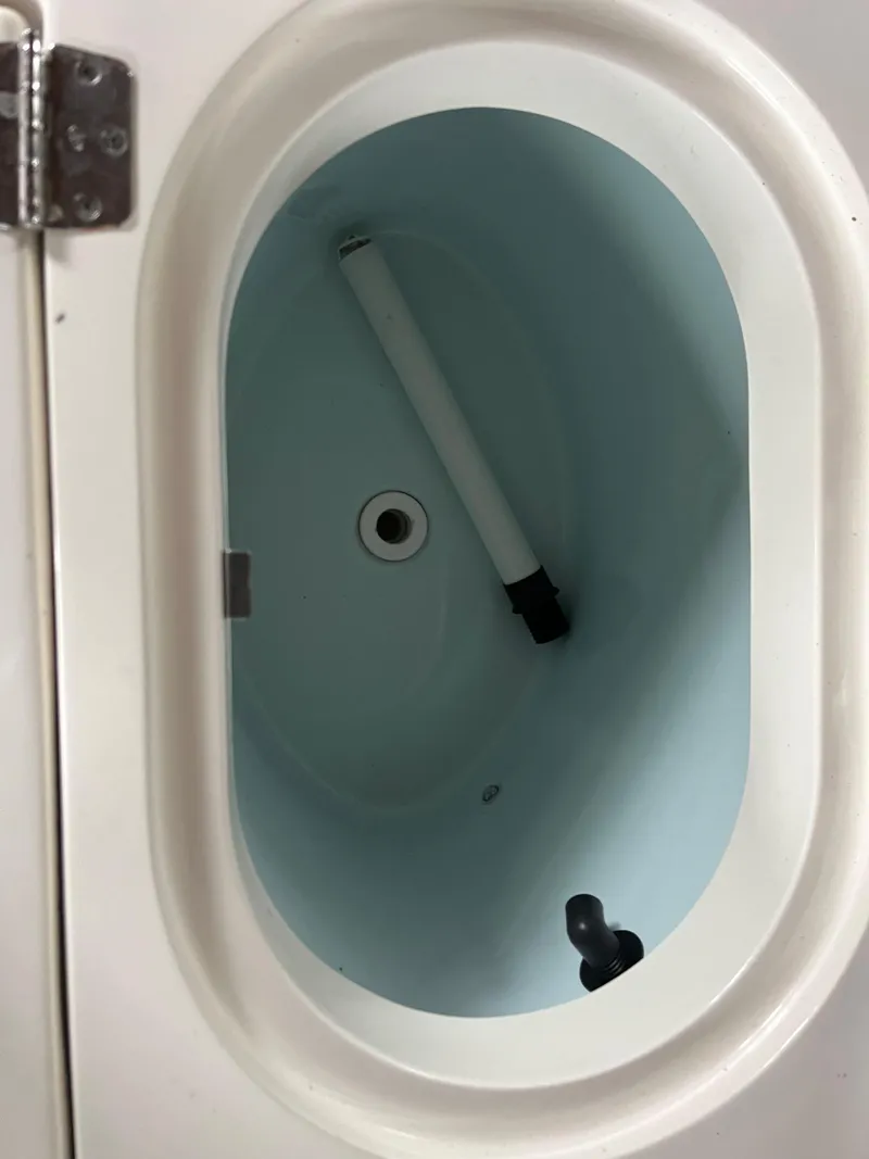 Slide: The Image of Livewell compartment of a 2016 Cobia 296 CC boat. - 13