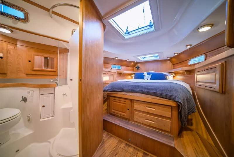 Slide: The Image of Luxurious Tartan 455 yacht interior with cozy bedroom and modern bathroom, 2025 model. - 16