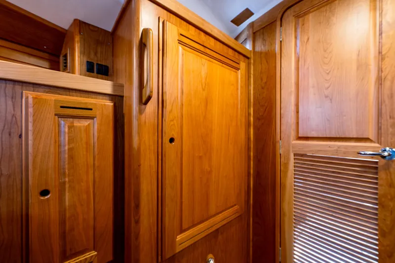 Slide: The Image of Interior wooden cabinetry of a 2025 Tartan 455 sailboat. - 18