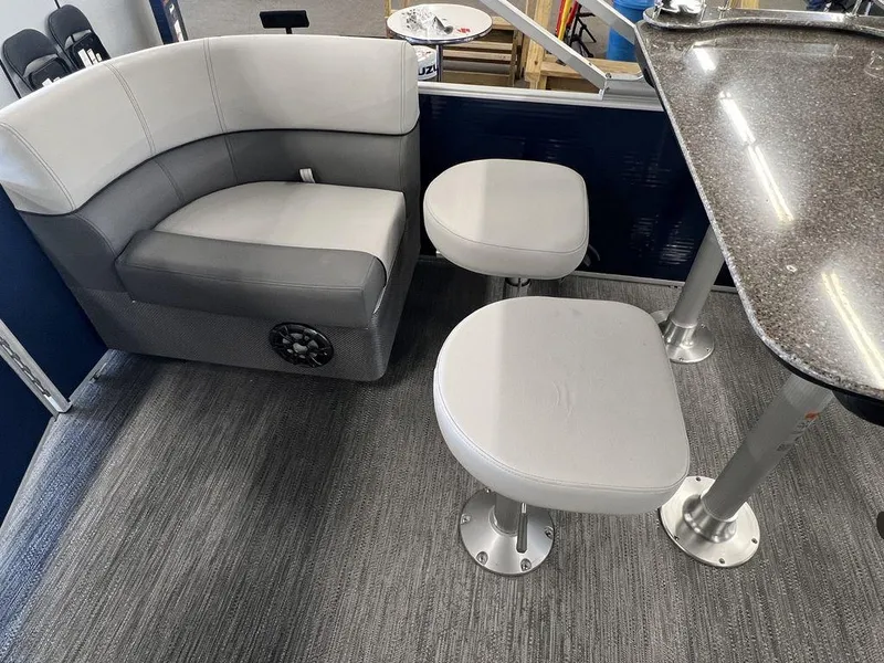 Slide: The Image of 2023 Godfrey SW 2286 MT boat interior with seating and table. - 11