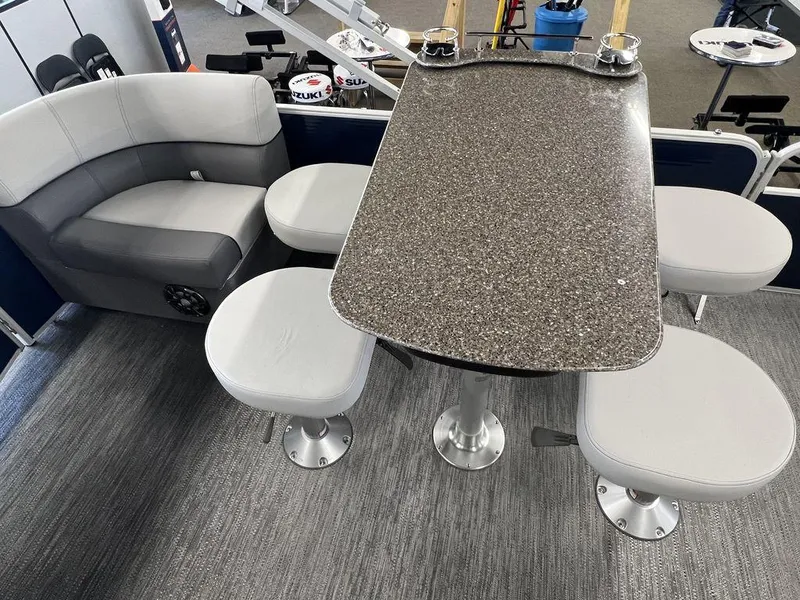 Slide: The Image of Interior seating and table of 2023 Godfrey SW 2286 MT pontoon boat. - 12